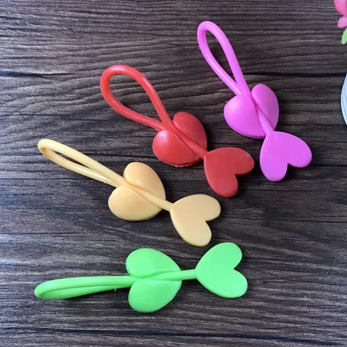 Vista 6 de STOBAZA Juego de 5 lazos reutilizables con forma de corazón de silicona, clip para pan, fácil de usar al azar