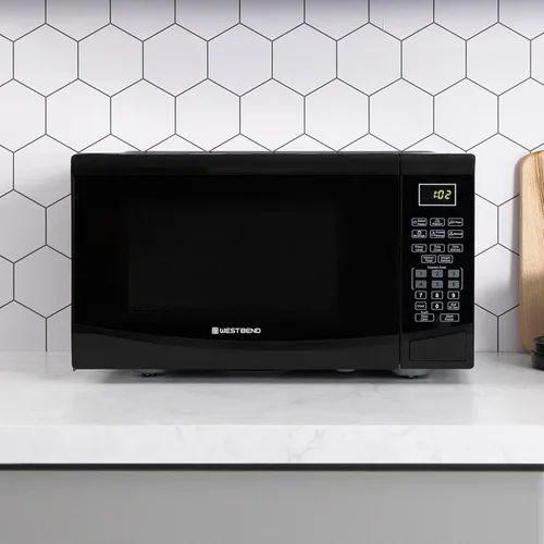 Vista 6 de Horno microondas West Bend WBMW92B de 900 vatios, compacto con 6 configuraciones pre-cocción, descongelamiento rápido, panel de control electrónico